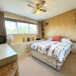 Cosy bedroom with modern decor and double bed.
