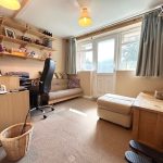 Cosy home office with desk and sofa.