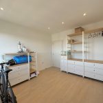 Minimalist room with shelves and bicycle