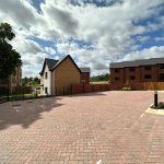 Empty brick parking area in residential estate