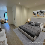 Virtually staged modern bedroom with artwork and lighting.