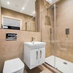 Modern bathroom with glass shower and sink