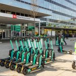 Milton Keynes Central station with electric scooters parked.
