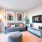 Modern living room with stylish decor and artwork.