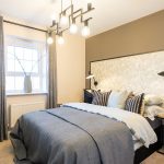 Modern bedroom with contemporary lighting and decor.