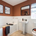 Modern bathroom with stylish decor and amenities.