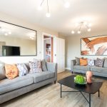 Cosy living room with modern decor and art.