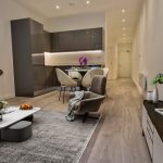 Contemporary open-plan living room and kitchen layout.