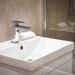 Modern bathroom sink with sleek faucet.