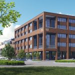 Modern office building with car park and trees.