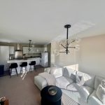 Modern open-plan kitchen and living room design.