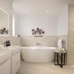 Modern bathroom with freestanding bathtub and elegant decor.
