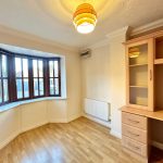 Bright room with bay window and wooden desk