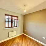 Empty room with wooden floor and window