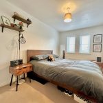 Cosy bedroom with modern decor and double bed.