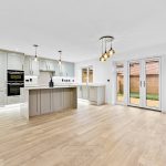 Modern kitchen with island and glass doors