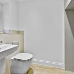 Modern minimalist white bathroom interior design.