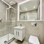 Modern grey tiled bathroom with shower