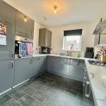 Modern grey kitchen with marble counters
