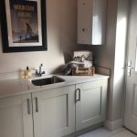 Modern utility room with sink and boiler.