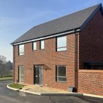 New red brick house with driveway