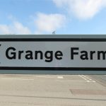 Grange Farm directional road sign.