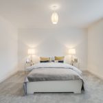 Bright minimalist bedroom with modern decor.