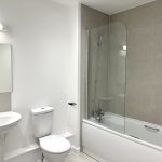 Modern bathroom with bathtub and shower.