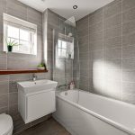Modern grey tiled bathroom with bathtub and sink.