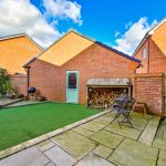 Outdoor patio with artificial grass and seating