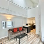 Modern living room with open-plan kitchen