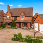 Brick house with driveway and garage