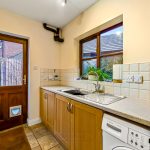 Modern kitchen with sink and garden view