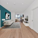 Modern open-plan living room and kitchen layout.