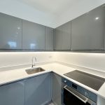 Modern grey kitchen with sink and oven