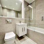 Modern bathroom with shower and vanity unit
