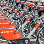 Row of Santander rental bicycles on street