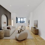 Modern living room with beige furniture and parquet flooring.