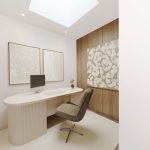 Minimalist office with desk, chair, and abstract art.