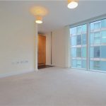 Modern empty room with large window and light.