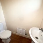Small bathroom with toilet and sink