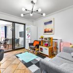 Modern family room with play area and kitchen