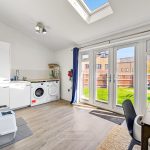 Bright kitchen with skylight and garden view.