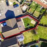 Aerial view of house with red boundary line.