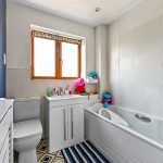 Bright bathroom with toys and modern decor