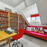 Room with model bus collection and computer desk.