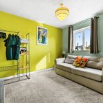 Room with colourful walls and comfortable sofa.