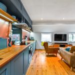 Modern open-plan kitchen and living room interior.