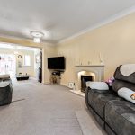 Cosy living room with sofas and fireplace.