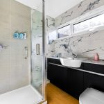 Modern bathroom with shower and marble tiles